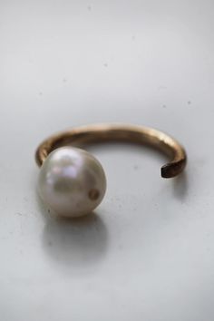 Simple and elegant, the Single Pearl Open ring makes for a perfect stacker or can stand on it's own.  Freshwater pearl and silver, also available in Gold Fill.  Other metals available upon custom request. Open Ring Gold, Ribbon Bracelets, Claw Ring, Single Pearl, Light Weight Jewelry, Butterfly Ring, Classic Jewelry, Rings Simple, Open Ring