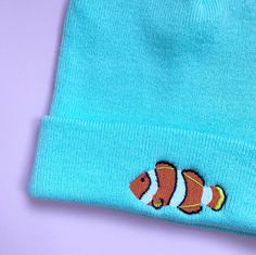 Clownfish Beanie Hat. Wonderful Embroidered Clownfish. Double layer knit. Vegan. Embroidery Ocean, Gift Embroidery, Ocean Fish, Clownfish, British Wildlife, Air Force Blue, Clown Fish, Beautiful Hats, Animals Of The World