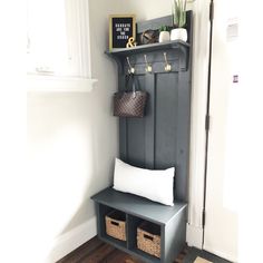 an entryway with a bench and baskets on the shelf, along with other items