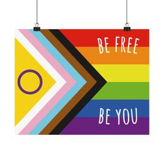 a colorful poster with the words be free and an image of a rainbow arrow on it