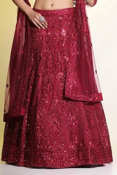 Maroon cancan attached lehenga featuring floral embroidery in matte and glossy sequined, cutdana, resham work all over. Paired with an embellished padded blouse and dupatta. - Aza Fashions Floor-length Sequin Fabric For Diwali, Eid Reception Lehenga With Sequins, Sequin Lehenga For Eid Reception, Reception Anarkali Sharara With Sequins, Sequined Anarkali Set For Reception, Red Sequined Dress For Navratri, Sequin Anarkali Traditional Wear For Reception, Anarkali Traditional Wear With Sequins For Reception, Anarkali Sequin Traditional Wear For Reception