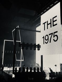 a large sign that reads the 1970 on it in front of a crowd at a concert