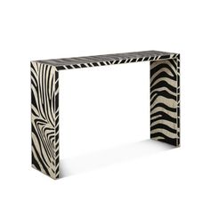 an animal print console table with black and white stripes