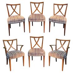 six chairs with wooden frames and plaid upholstered seats