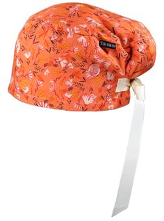 an orange hat with white ribbon tied to the brim and flower print on it