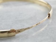 The detail on this vintage piece is stunning! Scrolling designs are engraved in warm yellow gold, decorating the bangle bracelet. This piece is chic and wearable, day or night! Metal: 14K Yellow Gold Width: 5.8 mm Inside Circumference: 7 Inches Marks: "RINE 14K NE14K" Stamped on the clasp Engraved Bangle, Bracelet Stacking, Yellow Gold Bangle, Warm Yellow, Cameo Ring, Enamel Brooch, Gold Bangle Bracelet, Gold Bangle, Gems Jewelry