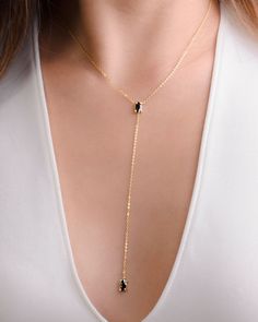 "Get back in black with your great taste in jewelry while enjoying a lovely lariat necklace with this Black Zircon Lariat Necklace. Featuring two dangling black zirconia gemstones, this black zircon necklace is the ideal way to wear a dangling necklace that has style and class! Great as a gift for the lady in your life that loves lariat necklaces and black zircon jewelry, this unique necklace will be sure to be her most treasured zirconia jewelry piece! Show her that you love her to the moon and Delicate Diamond Necklace, Diamond Initial Necklace, Horseshoe Pendant, Horseshoe Necklace, Zircon Necklace, Gold Letter Necklace, Hammered Hoop Earrings, Diamond Solitaire Necklace, Zircon Jewelry