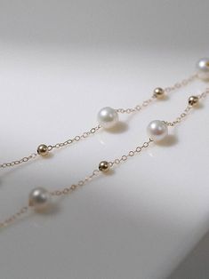 Featuring a celestial-inspired pendant and lustrous pearls, it offers timeless elegance. Adjustable for versatile wear, it's a celestial touch to elevate any ensemble. Metal: 14K Gold Filled Gemstone: Freshwater Pearls Pearl Diameter：6-7mm Length: 400-450mm Weight: 3.2g Luxury 14k Gold Pearl Chain Jewelry, Elegant White Necklaces With Satellite Chain, Celestial Gold Jewelry With Round Beads, Luxury Pearl Jewelry With Adjustable Chain, Elegant Gold Pearl Necklace With Satellite Chain, Elegant 14k Gold-filled Yellow Gold Pearl Necklace, Elegant Gold-plated Jewelry With Satellite Chain, Sliver Earrings, Necklaces Pearl