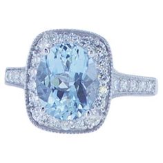 2.47ct Aqua Cocktail Ring featuring 0.59ct Total Weight of G/H Color VS Clarity Round Brilliant Diamonds in an 18k White Gold Mounting. Gia Certified Cushion Cut Diamond Ring, Luxury Diamond White Topaz Ring With Center Stone, Exquisite Gia Certified Diamond Ring Cushion Cut, Cushion Cut Diamond Topaz Ring In Fine Jewelry Style, Exquisite Gia Certified Cushion Cut Diamond Ring, Cushion Cut Topaz And Diamond Ring Fine Jewelry, Exquisite Cushion Cut Gia Certified Rings, Exquisite Gia Certified Cushion Cut Rings, Gia Certified White Cushion Cut Ring