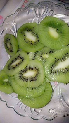 slices of kiwi on a glass plate