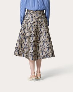 Metamorphos Tulips Brocade Midi Skirt - Side zip closure - Metamorphos Tulips Brocade (91% Polyester, 7% Metallic Polyester, 2% Polyamide) - Habotai lining (100% Silk) - Length: 87 cm / 34.3 in. from the waist in an Italian size 40 - The model is 176 cm / 5'9" tall and wears an Italian size 40 - Made in Italy The look of the model is completed by a Valentino Garavani Rockstud Spike Bag and Valentino Garavani The Bold Edition Shoes. Elegant Jacquard Skirt, Elegant Jacquard Bottoms For Spring, Luxury Full Skirt For Formal Occasions, Spring Jacquard Fitted Skirt, Spring Fitted Jacquard Skirt, Elegant Blue A-line Skirt, Elegant Blue Formal Skirt, Elegant Blue Cocktail Skirt, Elegant Blue Evening Skirt