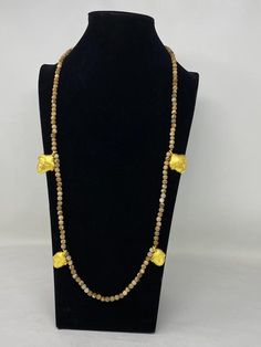 This listing is for 1 piece.At wholesale price!!!This is a Unique African designs majestic piece of jewelry statement long necklace. It is a beautiful and unique accessorize which will make a stunning addition to your costume. This is 100% handmade necklace with 7 mm Natural Wooden Matte Jasper with African Faces Charms made with 18K Matte Gold overlay over brass with anti tarnish. The necklace looks more beautiful in real life. If you need any more information please do not hesitate to contact Gold Hand-strung Agate Necklace, Gold Agate Beaded Necklace With Polished Beads, Gold Necklaces With Round Natural Stones, Gold Necklace With Round Natural Stone Beads, Gold Necklace With Round Natural Stones, Gold Agate Beaded Necklaces, Gold Agate Round Beaded Necklaces, Gold Round Agate Beaded Necklaces, Gold Gemstone Beads Long Necklace