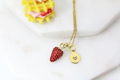 This is a gold-tone strawberry charm with hand stamped initial charm on a stainless steel chain. Tarnish Resistant! ♥ You will receive 1 necklace ♥ Alloy Enamel Pendants, Lead- Nickel Free, Size: about: 17x9x8mm ♥ Initial Disc Long-Lasting Plated, Real 18K Gold Deep Plated, Nickel Free, Flat Round, 8-10mm. **conversion : 1 inch = 25.4mm or 1mm = 0.0393 inch** ♥ All personalization is done by HAND. ♥ Raw materials the USA and international sourcing. ♥ Handcrafted with Love&Care by hands in Go Dainty Red Personalized Charm Necklaces, Dainty Personalized Red Charm Necklaces, Gold Stainless Steel Jewelry For Best Friend Gift, Gold Stainless Steel Jewelry For Best Friend, Gold Plated Nickel-free Charm Necklace For Gift, Brass Charms With Lobster Clasp For Gift, Hand Stamped Gold Jewelry For Best Friend, Personalized Red Stainless Steel Jewelry, Gold Hand Stamped Charm Necklace For Valentine's Day