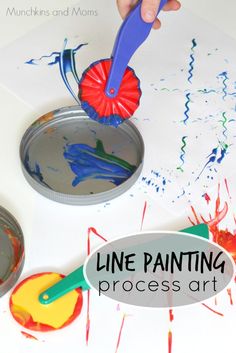 a child is painting with paint on paper