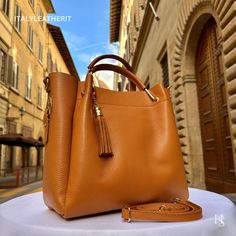 This bag has been made of the best genuine leather by local master crafters of Florence in Italy, designed for women who only accept premium Italian quality and luxury leather bags and modern Italian fashion. . Sizes: . Width 26cm/10.3 inches Height 29cm/11.5 inches Depth 15cm/ 6 inches Color: Brown . The Story of this bag :  Marco, a young and ardent traveler, found himself captivated by the enchanting city of Florence, Italy. As he wandered through the cobbled streets and admired the timeless High-end Leather Shoulder Bag With Leather Handles, High-end Leather Satchel For Everyday, High-end Leather Satchel With Leather Handles, High-end Leather Shoulder Bag For Everyday Luxury, High-end Leather Shoulder Bag For Everyday, High-end Brown Soft Leather Shoulder Bag, Everyday Luxury Leather Satchel Shoulder Bag, High-end Leather Bags For Daily Use, High-end Leather Bag For Everyday Luxury