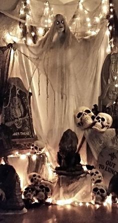 halloween decorations with skulls and lights in the background