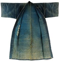 Large, heavy weight, densely sashiko stitched indigo dyed cotton jacket. Katazome stencil dyed cloth. Indigo background with red and white design on the reverse. Horizontal bands wrap around bottom of coat. Wonderful fading and overall hand. Used by firemen in late 19th century Japan to extinguish fires. Early to mid 1900s Katazome Stencil, Japanese Boro Jacket, Indigo Background, Indigo Japanese Textiles, Japanese Indigo Fabric, Vintage Indigo Pre-washed Outerwear, Meiji Era, Japanese Fabric Prints Vintage Kimono, Exeter