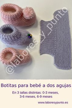 crocheted baby booties and diaper cover are displayed on a white table