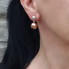 Featuring a unique design, one sphere in radiant silver and the other in warm copper, these earrings effortlessly blend sophistication with a contemporary twist. Let the contrasting metals dance together, creating a stylish and eye-catching accessory. The silver sphere is 6mm and the copper sphere is 10mm. 925 Sterling silver Copper Post back Approx. 0.9" L x 0.5" W Handmade in Taxco, Mexico Ball Drop Earrings, Dance Together, Ball Drop, Ball Earrings, Copper Earrings, Jewelry Handmade, Statement Earrings, Unique Design, Handmade Jewelry