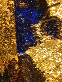 "Golden State Color- Deep Gold/Royal Blue 5mm Flip-Up Sequin Fabric by the yard. On spandex fabric only stretches 3% two way. Great for Gatsby look. Change the color of the fabric by just running your hands and flipping the sequin the opposite direction. Measurements: sequin size - 5mm Fabric Width - 60 inch Sequins Width 54 inch We sell by the Yard 36\"+ All cuts are continuous, so a quantity of 2 or more comes as one continuous piece. we inspect our fabric before shipping.if you have any issue Gatsby Look, Album Aesthetic, Sequins Fabric, Gold And Blue, Gold Sequins, Sequin Fabric, Just Run, Gold Sequin, Multiple Color