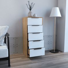 a white chair sitting next to a tall wooden cabinet on top of a hard wood floor