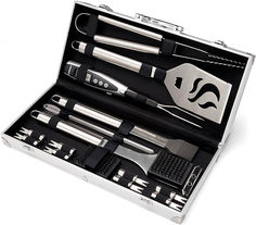 an assortment of kitchen utensils in a metal case