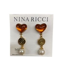 Nina Ricci Drop Pierced Earrings.  Triple 22kt gold plated  w Heart Cabochon and pearl. Designer, Vintage, Canadian, New piece Gold Pearl Earrings For Valentine's Day, Gold Heart-shaped Clip-on Jewelry, Valentine's Day Gold Clip-on Jewelry, Gold Dangle Pearl Earrings For Valentine's Day, Gold Pearl Earrings For Anniversary On Valentine's Day, Gold Heart-shaped Pearl Earrings For Pierced Ears, Gold Heart-shaped Earrings With Pearl Drop, Heart-shaped Gold Pearl Earrings For Pierced Ears, Valentine's Day Gold Pearl Earrings For Anniversary