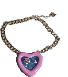 TRENDY NECKLACES : The Chain necklace featuring colorful pink heart-shaped pool pendant adorned with playful Betsey babe and minimal stones. LIGHTWEIGHT NECKLACES : Lightweight necklace easy to put on and take off.  Necklace has an adjustable lobster clasp closure. MEASUREMENTS : 16" + 3" Extender (L), Pendant Drop: 2.4" PERFECT FOR GIFTING : Wonderful gift for all year-round . HYPOALLERGENIC JEWELRY: Made with nickel and lead free metal that is less likely to cause any allergic reaction.  Additional materials include glass crystal. All sells are final! Pink Clavicle Chain Charm Necklace For Party, Party Heart Pendant Necklace With Adjustable Chain, Party Heart Necklace With Adjustable Chain, Pink Pendant Chain Necklace Gift, Adjustable Heart Pendant Necklace For Party, Pink Pendant Chain Necklace As Gift, Heart Pendant Necklace With Adjustable Chain For Party, Pink Clavicle Chain Necklace For Valentine's Day, Trendy Necklaces For Valentine's Day Party