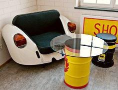 a chair and table in a room with a shop sign on the wall behind it