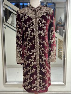 Stunning Pure Shaffon Silk Velvet Groom's Masterpiece: An opulent maroon velvet sherwani. On your special day, wear our Pure Maroon Velvet Sherwani to look like a queen. The exquisite shaffon silk velvet is adorned with hand-stitched zardozi decorations, which combine elegance and sophistication to create a captivating blend. Your distinctive dark maroon colour makes you stand out. Our goal is to deliver premium perfection, not just decent quality. This sherwani was painstakingly created just fo Velvet Sherwani For Men, Sherwani Pakistani, Velvet Sherwani, Wedding Sherwani For Men, Groom Sherwani, Maroon Colour, Elegant Texture, Sherwani For Men, Wedding Sherwani