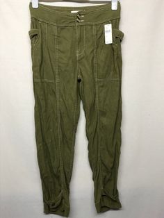 AA6 Has a tiny hole on the left tie belt, not visible at all By Anthropologie Tie-Waist Tapered Utility Trousers Khaki Pants Crop Size US 2 Measurement laying flat Waist Across:   15"   Hip:    18" Inseam:   26" Length:  36" CONDITION: Excellent New with tag condition. This is the photos of the actual item you will receive. Please examine the photos carefully as they are part of the description. I want you to be happy with your purchase and since sizes vary so much, please go by the true measure Olive Utility Bottoms For Fall, Olive Pants With Pockets For Fall, Olive High Waist Utility Bottoms, Olive Utility Trousers, High-waist Olive Pants With Pockets, Olive High-waist Pants With Pockets, Olive High-waisted Bottoms With Pockets, Baggy Military Bottoms For Spring, Baggy Military Style Bottoms For Spring