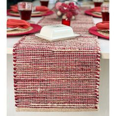 the table is set with red and white place mats