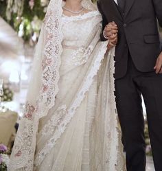 the newly married couple is posing for a photo together in their wedding day dress and tuxedo