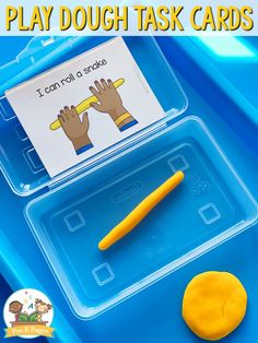 a plastic tray with two hands and a yellow object in it that says, i can play dough task cards