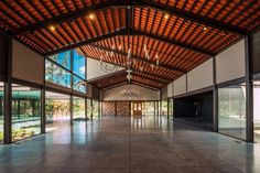 the inside of an empty building with chandeliers hanging from it's ceiling