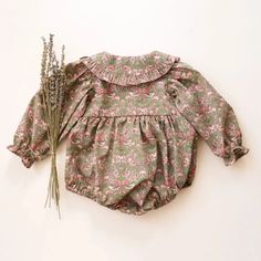 Made from Organic Cotton: An eco-friendly, breathable, and hypoallergenic fabric that’s gentle on delicate skin. Care Instructions: Machine wash on a gentle cycle, tumble dry on low. A Thoughtful Gift: Ideal for birthdays, holidays, or any day you want to make extra special for the little one in your life. Womens Dress Suits, Ruffle Romper, Swim Shop, Floral Romper, Dress Suits, Accessories Jacket, Toddler Boys, Vintage Floral, Mens Sweatshirts