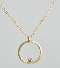 "Minimal Rustic Necklace with a flash of sparkle & color. We completely fabricate the pendant in our studio. The Gold Filled circle is hammered for interest. The 3mm Amethyst is tube set and nestled inside the circle. You can choose to add up to two more birthstones to this pendant for the perfect gift for mom, sister, aunt, grandma. Necklace: Hammered Gold Filled Circle with Amethyst CZ Birthstone - High quality Gold Filled Chain made to your size 16-20\". - Perfect on its own or as a layer Amethyst Birthstone Necklace With Round Pendant, Purple Necklace With Large Round Pendant, Hand Forged Amethyst Pendant Necklace, Hand Forged Purple Pendant Necklace, Hand-forged Purple Pendant Necklace, Amethyst Gemstone Birthstone Necklace With Round Pendant, Amethyst Birthstone Round Pendant Necklace, Amethyst Gemstone Round Pendant Necklace, Purple Round Pendant Necklace For Anniversary