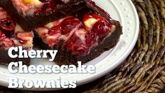 cherry cheesecake brownies on a white plate