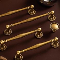 brass handles and knobs on a brown table