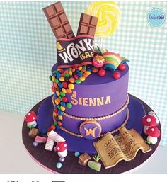 a purple cake with candy and candies on top is featured in an instagram