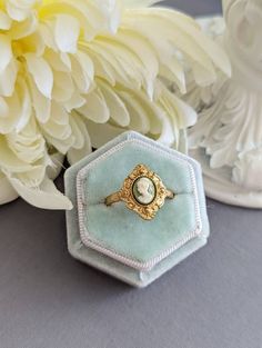 An enchanting cameo ring that features a classic portrait of a Grecian Goddess in a bezel setting. Resembling a kite-shaped shield, the ring face is decorated with ornate milgrain detailing. SIZE: This ring is adjustable, which is convenient if you aren't sure what size your recipient's finger is or if you like wearing rings on different fingers.  In order to resize the ring, simply slide apart the two pieces on the back or underside of the ring and push them together. The smallest I can manage Cameo Ring Gem, Victorian Cameo Rings For Anniversary, Antique Cameo Signet Ring For Weddings, Victorian Cabochon Opal Ring For Gift, Victorian Style Cabochon Opal Ring Gift, Victorian Opal Cabochon Ring As Gift, Vintage Cameo Rings For Wedding, Victorian Opal Ring For Wedding, Victorian Opal Oval Cabochon Ring For Wedding