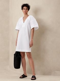 Poplin Knee-Length Dress | Banana Republic Factory Modern V-neck Mini Dress For Spring, Casual V-neck Midi Dress With Pleated Sleeves, Modern V-neck Spring Dresses, Spring V-neck Mini Dress With Pleated Sleeves, Chic V-neck Mini Dress With Pleated Sleeves, Modern V-neck Dresses For Daywear, Modern V-neck Summer Dress, Elegant Relaxed Fit Mini Dress For Spring, Modern V-neck Midi Dress For Spring