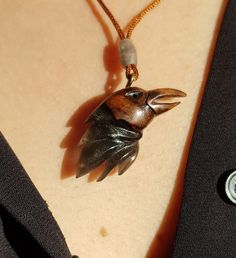 This is a 100% handmade Resin & Stabilized Wooden necklace. I'm proud to have this handmade necklace in my shop. This Raven Bird pendant will make a perfect unique gift for Christmas, i will send it in a nice giftbox. This necklace is made of Resin & Stabilized Wood and completely handcrafted. Every detail is carefully handcarved. Cord is adjustable Ready and packed for shipping, what you see is exactly what you get. Please contact me for custom order. Carved Spiritual Jewelry Gift, Spiritual Carved Jewelry As Gift, Carved Amulet Jewelry For Gifts, Carved Amulet Jewelry For Gift, Bird Design Round Pendant Jewelry For Gifts, Bird Design Round Pendant Jewelry Gift, Adjustable Bird Design Jewelry Gift, Bird Design Round Pendant Jewelry As Gift, Adjustable Bird Design Jewelry For Gifts