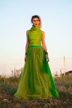 Green Pleated Stretch Maxi Skirt, Green Stretch Pleated Maxi Skirt, Green Stretch Maxi Skirt With Pleats, Avant-garde Fitted Skirt For Summer, Green Tulle Maxi Skirt For Summer, Summer Green Tulle Maxi Skirt, Green Voluminous Maxi Skirt For Spring, Green Flowy Party Skirt, Green Summer Party Maxi Skirt