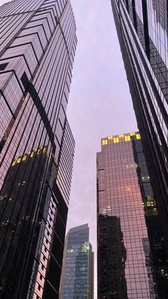 looking up at skyscrapers from the ground