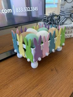 an easter egg holder with bunny ears on it