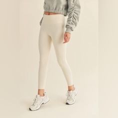 These Cream High-Rise Leggings Are A Must Have Closet Staple! Quick-Drying, Breathable And Weightless Fabric With A Butter Soft Feel And Four-Way Stretch. The Color Is A Must For Spring And Summer! Details: 75% Nylon, 25% Spandex Color Is Cannoli Cream Butter Soft Feel Wide High-Rise Waistband Inseam: S- 26" , M- 26.25" , L- 26.50" *Model's Measurements: Height 5'8.5" | Bust 34" | Waist 25" | Hips 35.5" Beige High Stretch Athleisure Bottoms, Beige High Stretch Bottoms For Athleisure, Beige Stretch Bottoms With Ribbed Waistband, Beige Full Length Workout Bottoms, Full Length Beige Workout Bottoms, Cream Stretch Long Pants, Beige Compression Athleisure Bottoms, High Stretch Beige Leggings, High Waist Beige Yoga Leggings