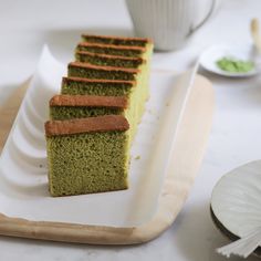 slices of green tea cake on a white plate