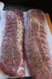 two raw meats sitting on top of a cutting board