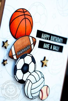 a close up of a birthday card with a ball and basketball on top of it